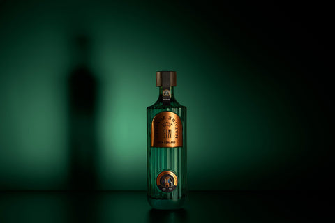 Green bottle with a gold label on a dark green background